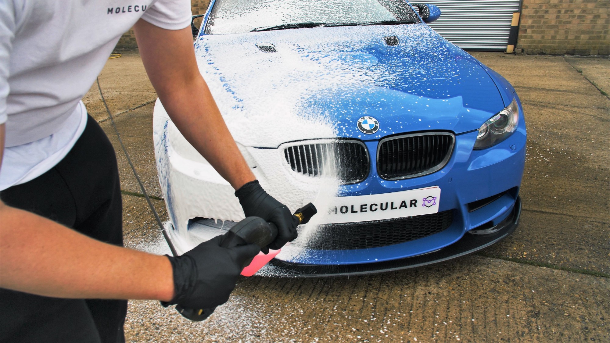 Cyclone Premium Snow Foam being applied to blue BMW